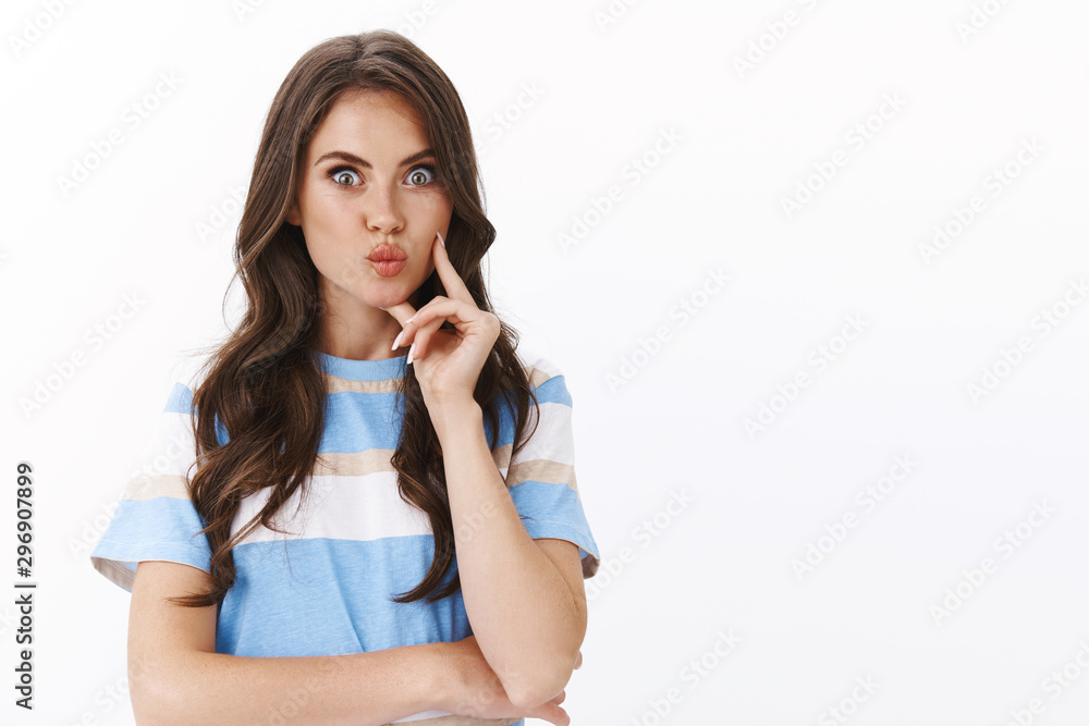 Silly glamour young modern woman thinking excited summer vacation, pouting look amused and upbeat, smiling touch chin thinking, pondering receive good choice opportunity, white background Silly glamour young modern woman thinking excited summer vacation, pouting look amused and upbeat, smiling touch chin thinking, pondering receive good choice opportunity, white background