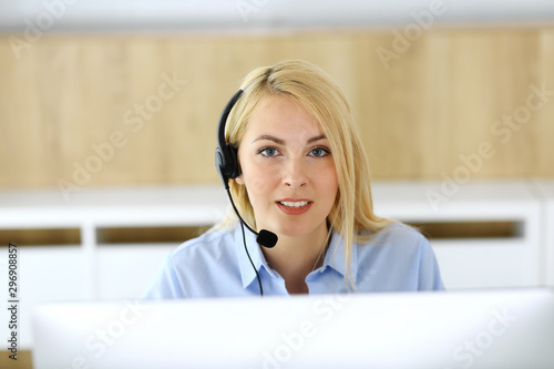 Wallpaper Mural Call center. Blonde business woman sitting in headset at customer service office. Concept of telesales business or home office occupation Torontodigital.ca
