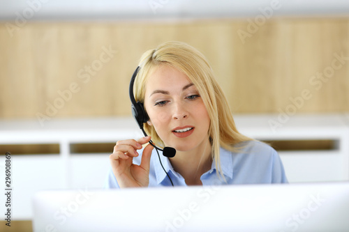 Wallpaper Mural Call center. Blonde business woman sitting in headset at customer service office. Concept of telesales business or home office occupation Torontodigital.ca