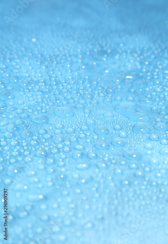 Close up water drops on blue background, Water drop in macro photography