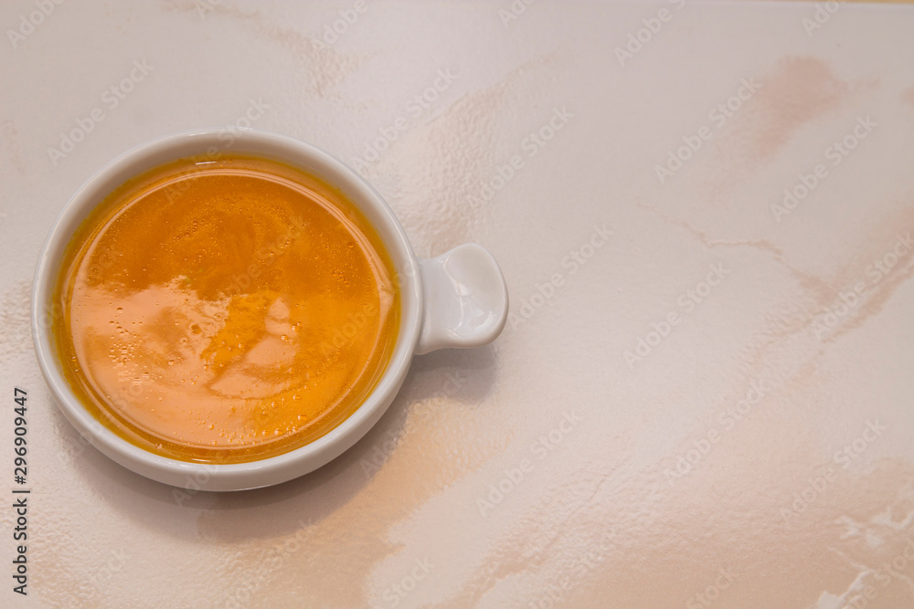 bowl with pumpkin soup on background bowl with pumpkin soup on background