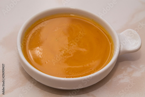 bowl with pumpkin soup on background © tetxu