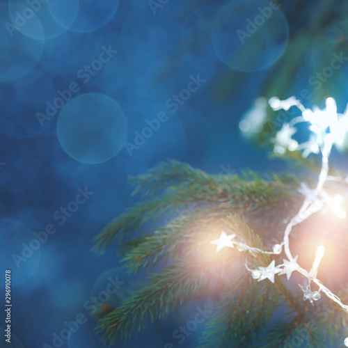 Christmas decorations in bright blue red and white shiny colors with Christmas lights with blurred background.