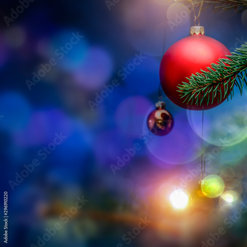 Christmas decorations in bright blue red and white shiny colors with Christmas lights with blurred background.