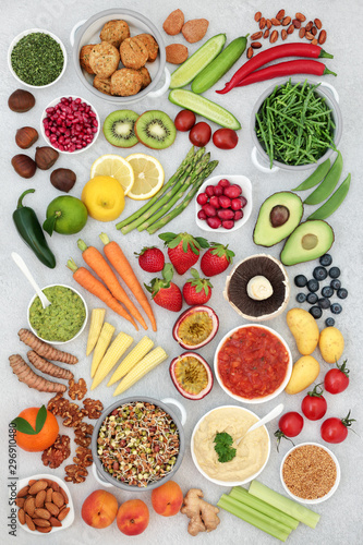 Fototapeta Naklejka Na Ścianę i Meble -  Healthy vegan super food concept with fruit, vegetables, seeds, nuts, spice, dips & falafel meat substitute. High in vitamins, minerals, antioxidants, protein, omega 3, dietary fibre & smart carbs. 