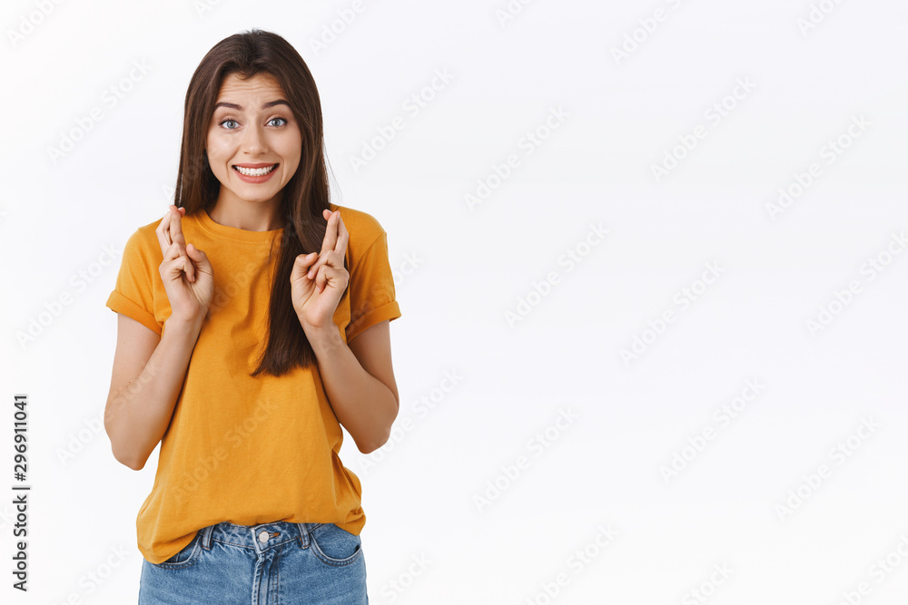 Cheerful, hopeful and optimistic cute sligtly nervous brunette girl having faith in herself, wishing pass exam, smiling anticiapting results, cross fingers good luck, praying, want dream come true Cheerful, hopeful and optimistic cute sligtly nervous brunette girl having faith in herself, wishing pass exam, smiling anticiapting results, cross fingers good luck, praying, want dream come true