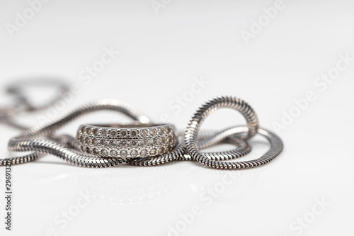 Delicate silver diamond ring and silver chain with elegant design
