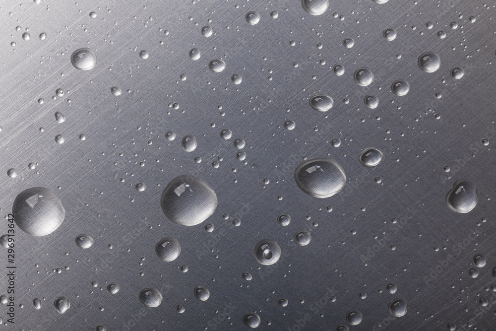 dots of water on dark metal surface, macro background, horizontal shot dots of water on dark metal surface, macro background, horizontal shot