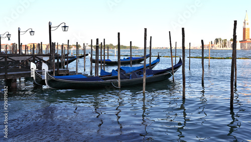 Gondolas rest at their moorings, Venice - Italy © diak