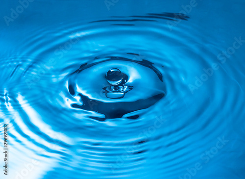 blue glass colored water drop splash