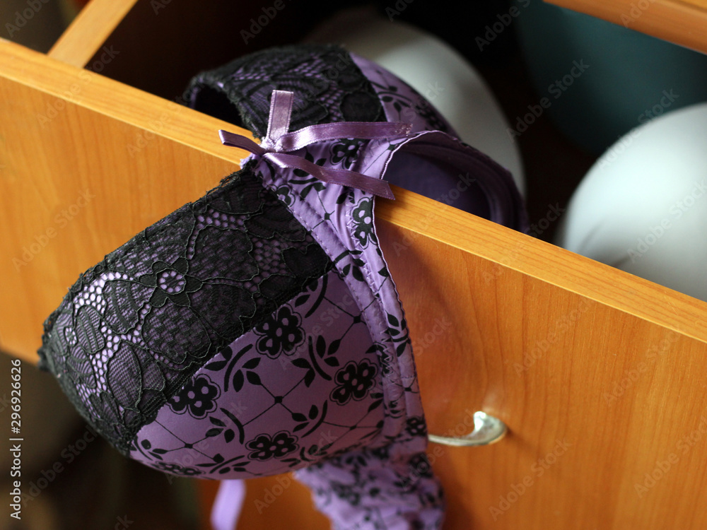 Beautiful fishnet bra and open underwear drawer, purple color