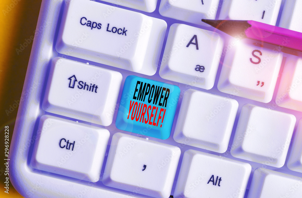 Conceptual hand writing showing Empower Yourself. Concept meaning taking control of our life setting goals and making choices White pc keyboard with note paper above the white background Conceptual hand writing showing Empower Yourself. Concept meaning taking control of our life setting goals and making choices White pc keyboard with note paper above the white background