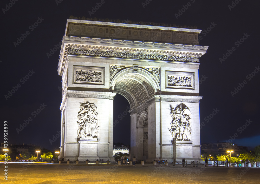 Triumphal arch (Arc de Triomphe) at night, Paris, France