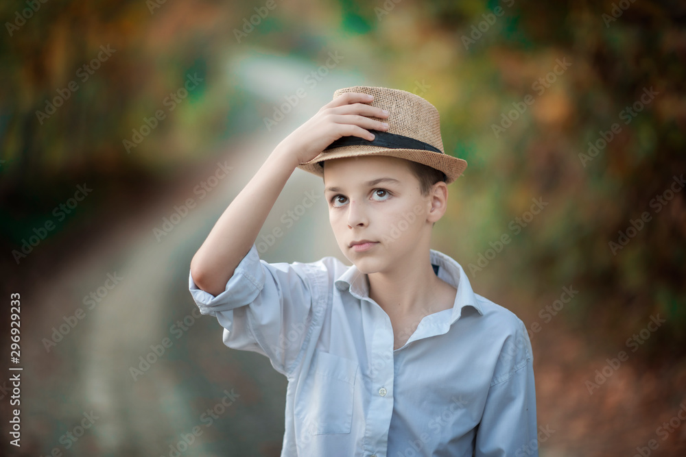 portrait of a boy with a summer hat