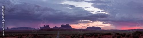 panorama of the highway to monument valley at sunset with purple sky