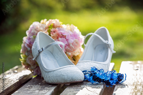 beautiful weddingshoes with blue garter photo