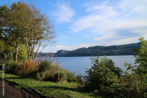 landscape with loch and blue sky
