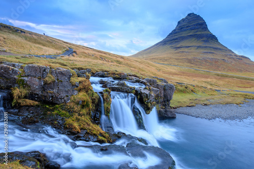Iceland timelapse photography of waterfall and famous mountain. Kirkjufellsfoss and Kirkjufell in northern Iceland nature landscape © Johannes