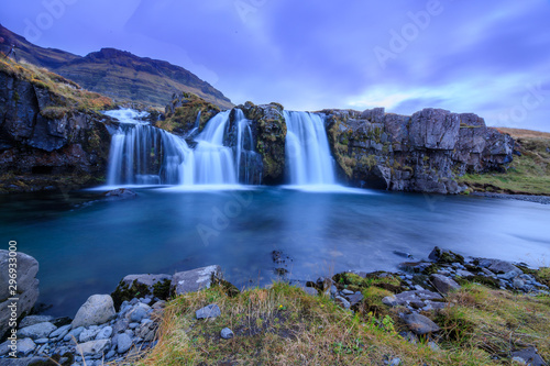 Iceland timelapse photography of waterfall and famous mountain. Kirkjufellsfoss and Kirkjufell in northern Iceland nature landscape