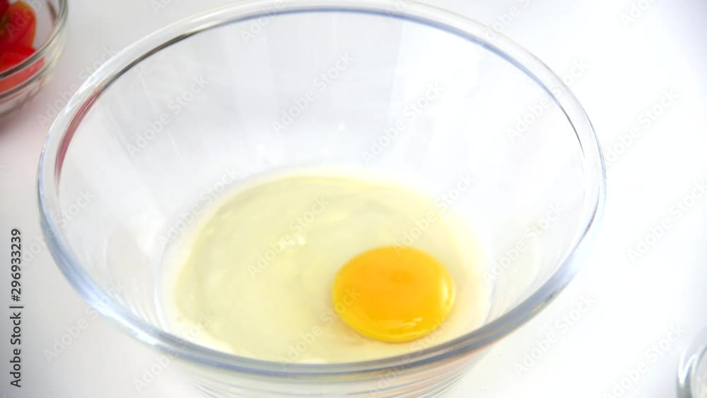 Stirring egg in bowl, homemade cooking scrambled eggs Stirring egg in bowl, homemade cooking scrambled eggs