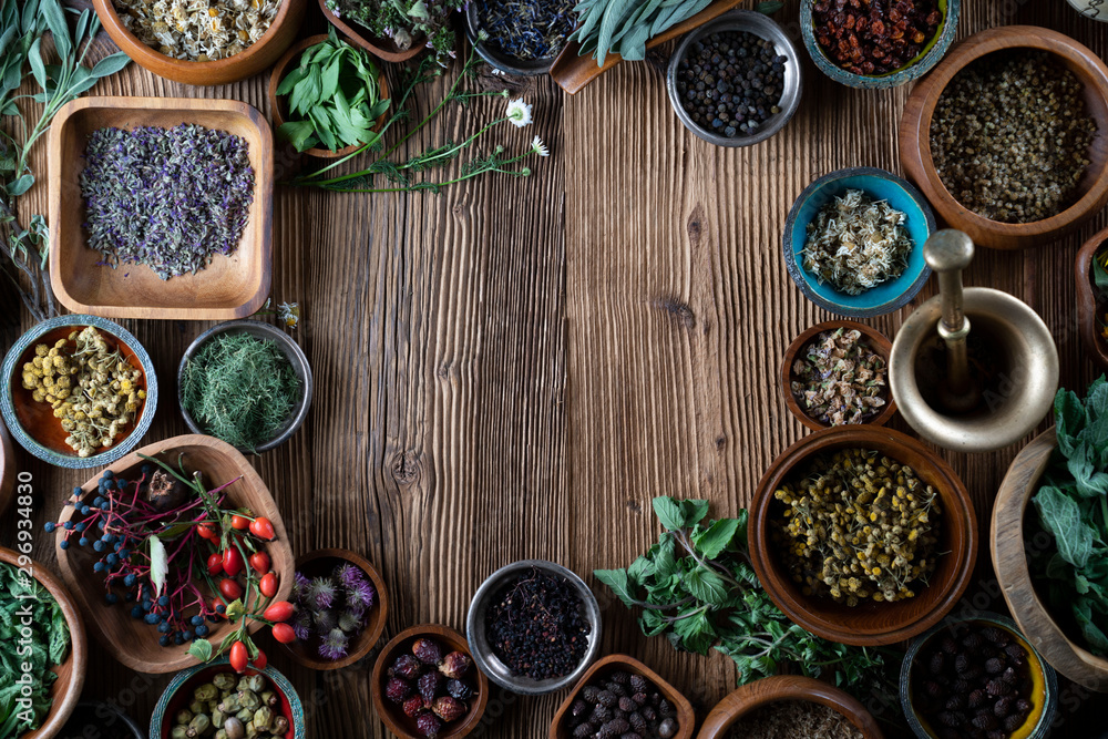 Set of colorful spices in different bowls on wooden table Set of colorful spices in different bowls on wooden table
