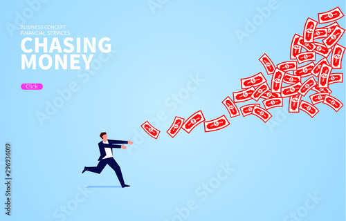Businessman chasing flying money