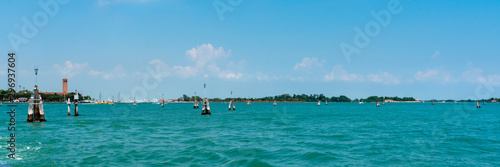 Wallpaper Mural Venice. Island Lido. Panoramic view of beautiful Venetian lagoon. Yachts on the horizon on blue sky background. Header. Banner.  Torontodigital.ca
