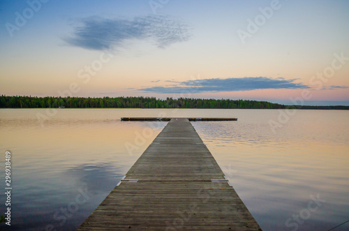 Wallpaper Mural Beautiful landscape with wooden water floater for swimmers and cloud passing by during a tranquil day Torontodigital.ca