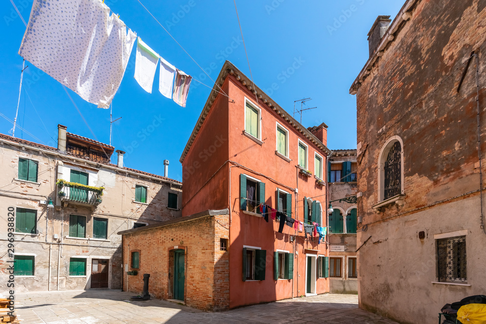 Venice. Colorful laundry is dried on the clothesline between the houses. Ancient Italian city. Travel Tourism in Europe. 