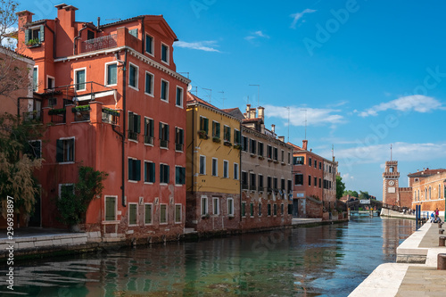 Venice. Panoramic view of Venetian colorful houses and canals. Arsenal building on the horizon. Biennale, world modern art exhibition.