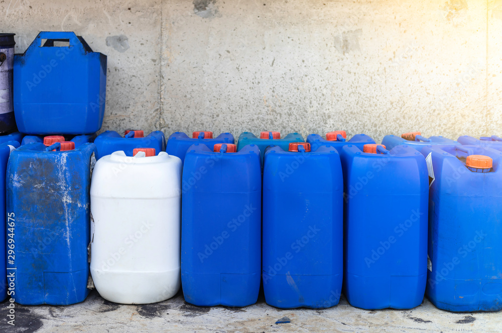 Group oil barrels or chemical of blue plastic gallons,Blue plastic  container size 30 liters on the cement floor in the ware house. Stock Photo  | Adobe Stock