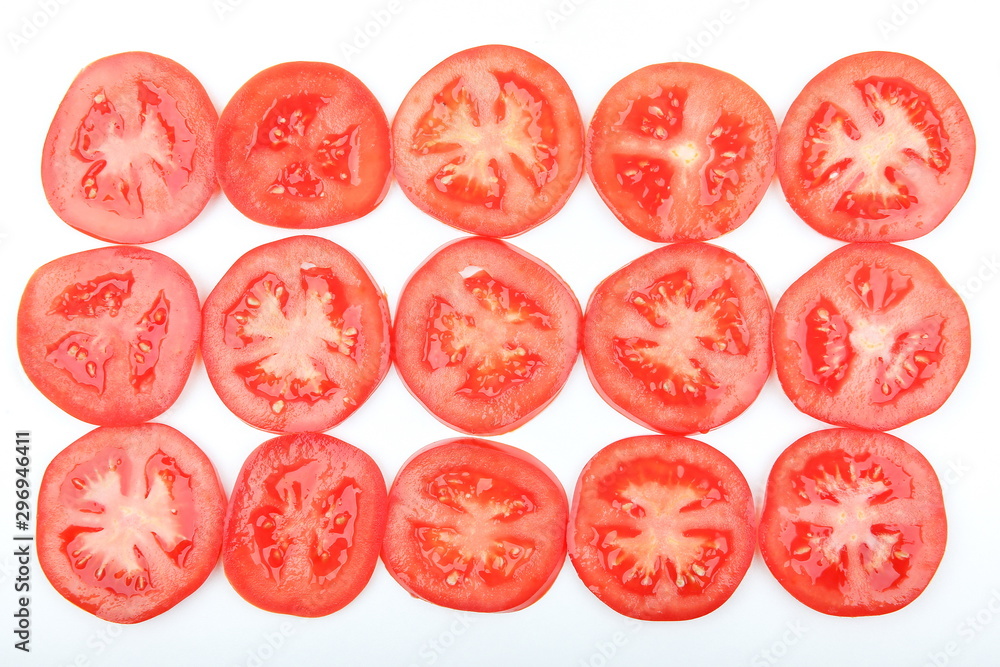 background of rings of tomatoes on white background background of rings of tomatoes on white background