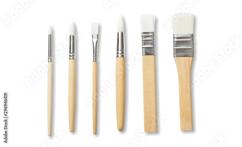 Paint brushes new clean with wooden handle isolated against white background.