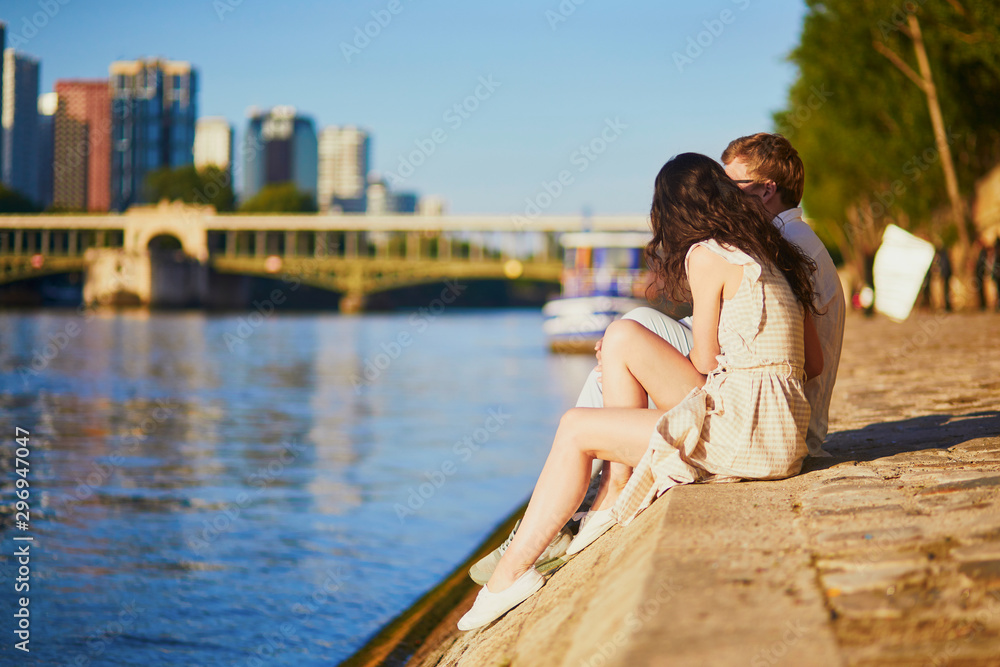 Happy romantic couple in Paris, near the river Seine