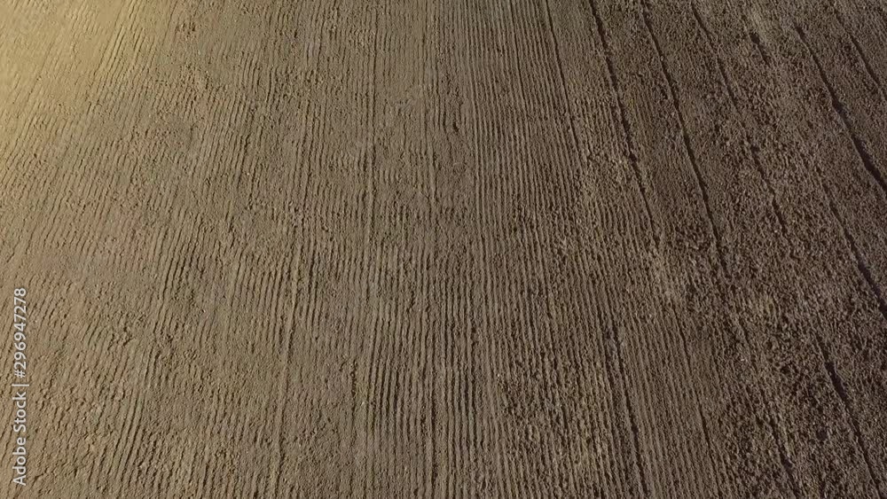 aerial view dry field after being plowed and sown aerial view dry field after being plowed and sown