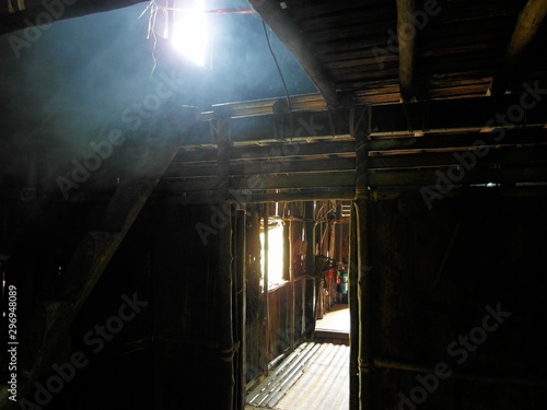 Tropical Hut Inside With Sun Light Through Window adn Smoke Inside