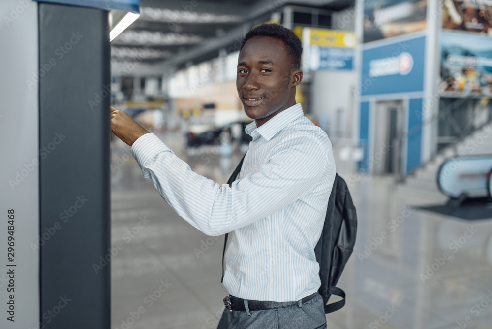 Businessman at coffee machine in car dealership Businessman at coffee machine in car dealership
