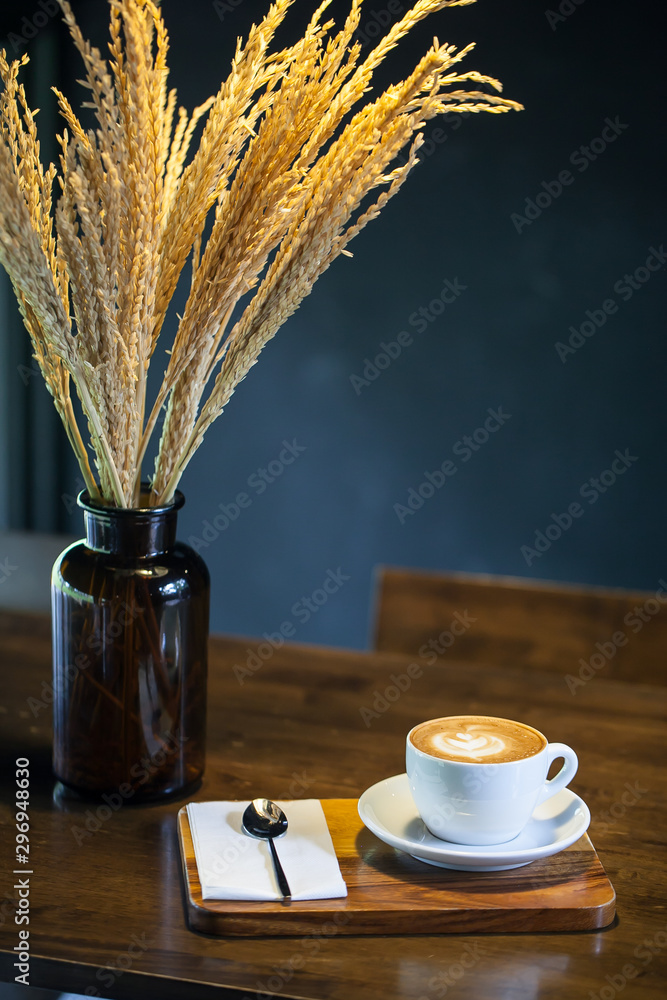 cup of coffee on wooden table, vintage color
