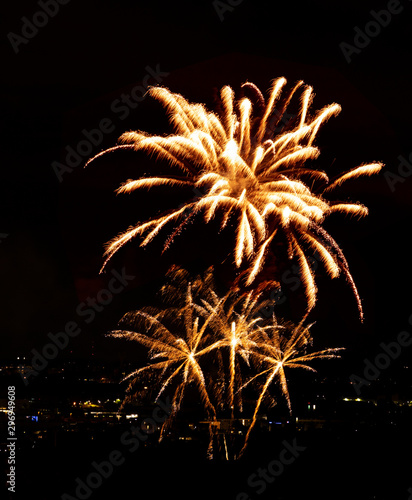 Fireworks display over small city