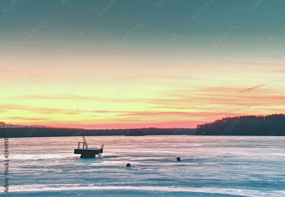 Summer resort under ice within long winter. Breathtaking sunset Summer resort under ice within long winter. Breathtaking sunset