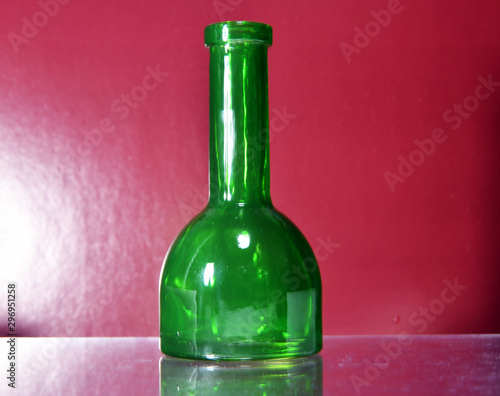 green bottle on brown background