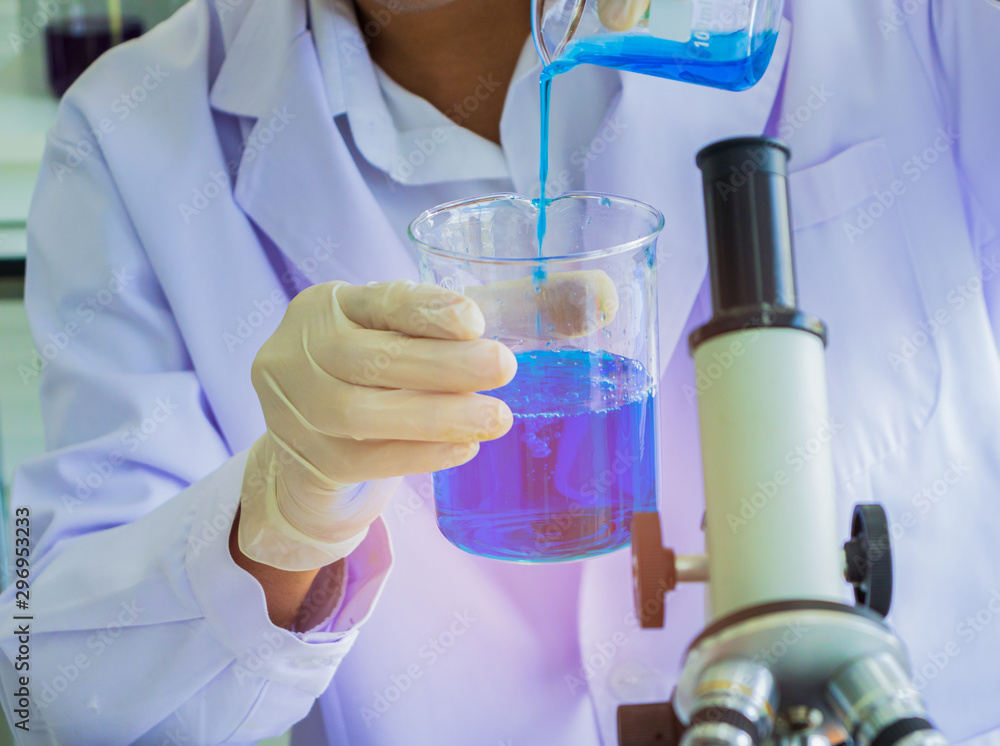 Medical laboratory Scientists use microscopes for testing liquid biology. Medical laboratory Scientists use microscopes for testing liquid biology.