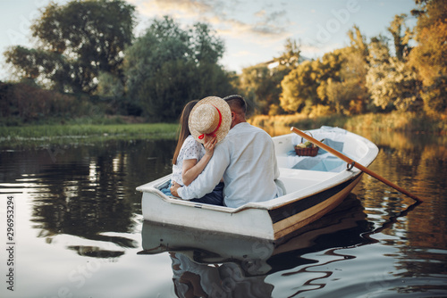 Fototapeta Love couple kissing in boat on lake