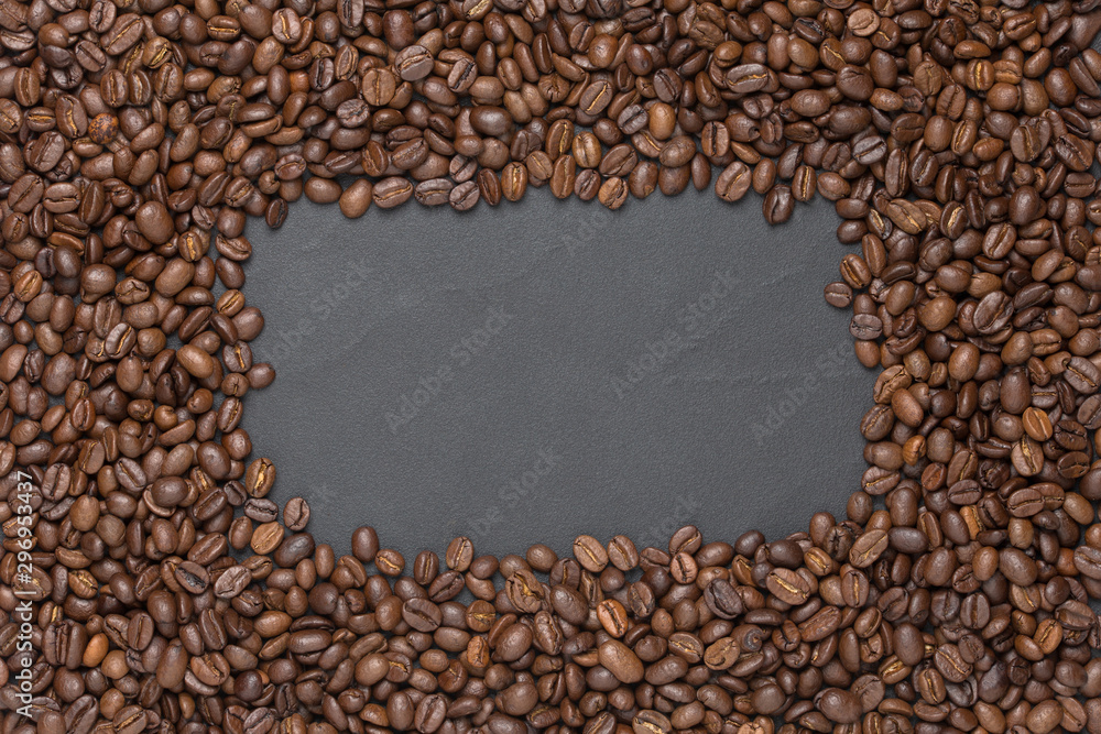 Roasted coffee beans frame background on black with copy space Roasted coffee beans frame background on black with copy space