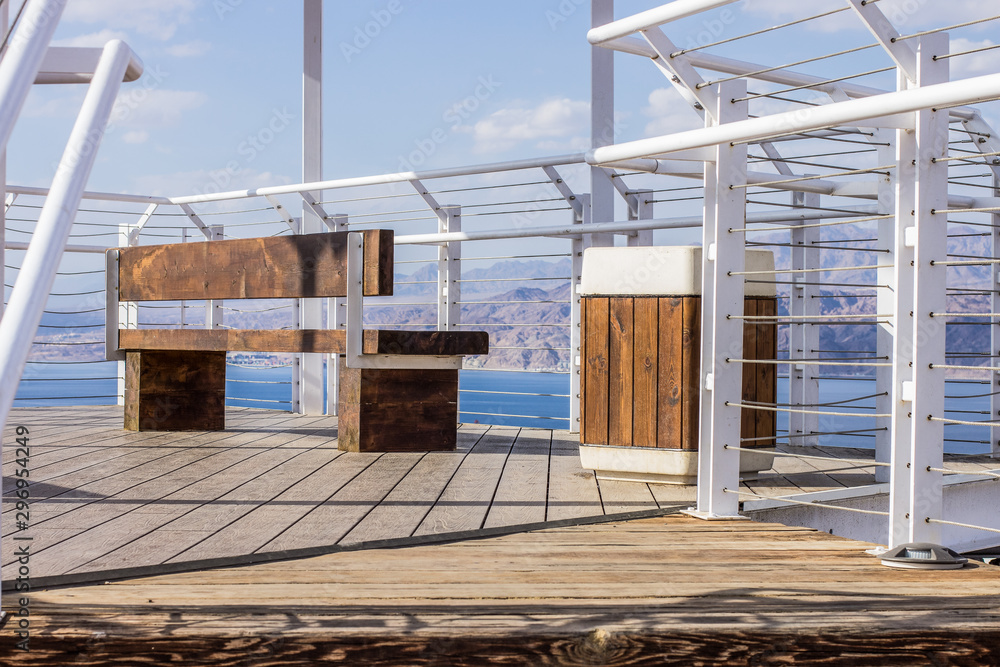 Obraz premium view point terrace white pipes frame and wooden deck floor with bench for sitting landscaping urban object