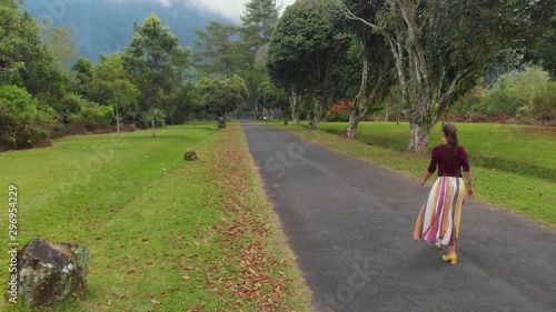 Wallpaper Mural Fashion woman is going in Balinese park in Bali Torontodigital.ca