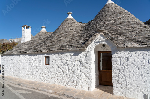 Trulli of Alberobello. View of Trulli houses .The traditional Trulli houses in Alberobello city, Puglia, Italy - April 30, 2019: Church in Trullo Parish Sant'Antonio of Padua - Immagine