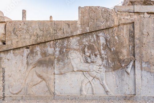 Carved stone wall in ancient Persepolis, located in Fars Province, Iran photo