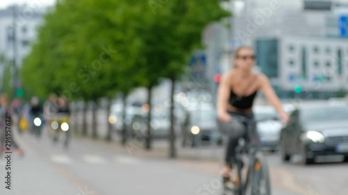 Wallpaper Mural Сyclists move on a bike path, road traffic Torontodigital.ca