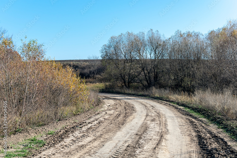 Dirt road in autumn sunny day Dirt road in autumn sunny day